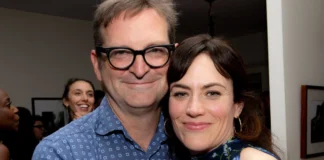 Paul Ratliff attending a public event with Maggie Siff, both smiling and dressed elegantly.