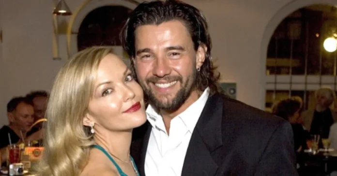 Carolin Bacic standing beside Steve Bacic, both smiling warmly at a public event.