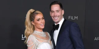 Carter Reum smiling at a luxury event, highlighting his success and wealth, featured in our Carter Reum Net Worth article.