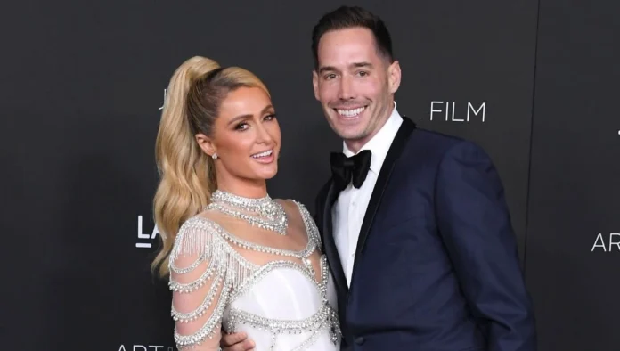 Carter Reum smiling at a luxury event, highlighting his success and wealth, featured in our Carter Reum Net Worth article.