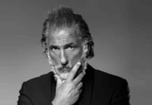 Elon Tobiana, the French luxury influencer known as "Zeus Monaco" with his signature silver hair and beard.