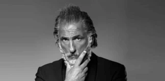 Elon Tobiana, the French luxury influencer known as "Zeus Monaco" with his signature silver hair and beard.