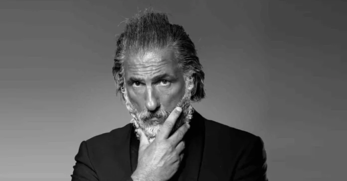Elon Tobiana, the French luxury influencer known as "Zeus Monaco" with his signature silver hair and beard.