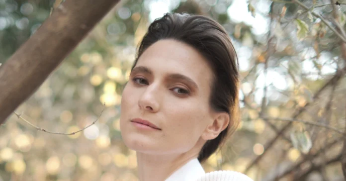 Portrait of Ortal Ben Shoshan, the Moroccan-Israeli actress known for her roles in Israeli TV and Netflix series, captured in a natural outdoor setting.