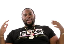 Peezy Rapper performing on stage in Detroit, engaging the crowd with his energetic presence and signature hip-hop style.