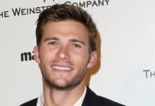 Scott Eastwood poses confidently on the red carpet at a Hollywood premiere, capturing the charisma and style that define his rising career.