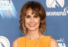 Diane Farr smiling at a red carpet event, representing Diane Farr Net Worth and her successful career in Hollywood.