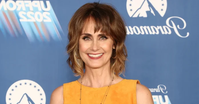 Diane Farr smiling at a red carpet event, representing Diane Farr Net Worth and her successful career in Hollywood.
