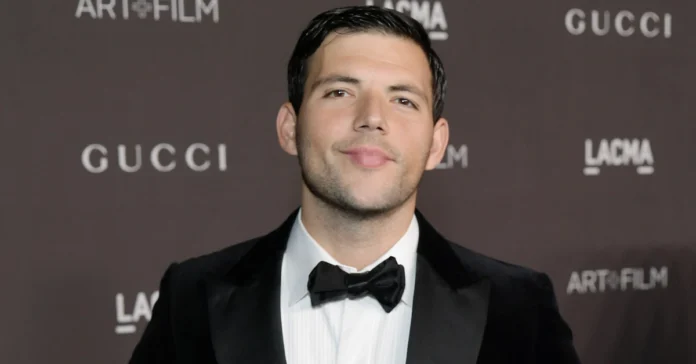 Portrait of Elan Ruspol, American talent agent and husband of Jacqueline MacInnes Wood, at a red carpet event showcasing his professional and personal presence.