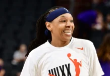 Emma Cannon in action on the basketball court, showcasing her skills and determination during a professional WNBA game.
