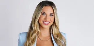 Erin Dolen, ESPN sports betting analyst, smiling confidently in a light blue blazer with blonde hair and professional appearance