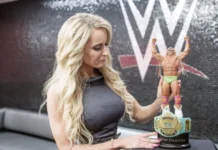Dana Warrior holding Ultimate Warrior action figure and championship belt, mother of Mattigan Twain Warrior