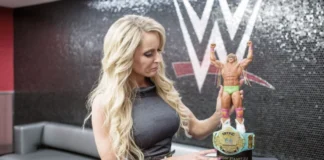 Dana Warrior holding Ultimate Warrior action figure and championship belt, mother of Mattigan Twain Warrior