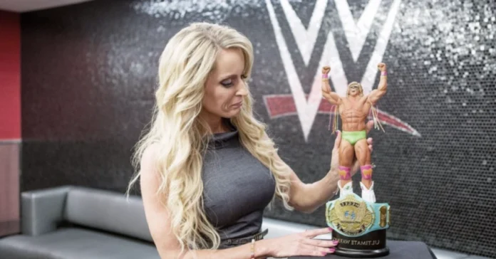 Dana Warrior holding Ultimate Warrior action figure and championship belt, mother of Mattigan Twain Warrior
