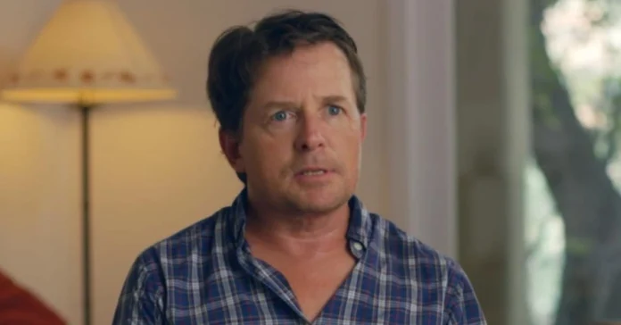 Michael J Fox net worth actor in plaid shirt interview discussing career earnings