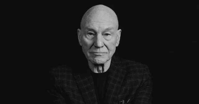 Patrick Stewart seated confidently in a stylish blazer, embodying his iconic presence as a legendary actor in film and television.