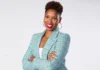 Portrait of Monica McNutt, basketball analyst and media personality, confidently presenting insights on sports with a professional backdrop.