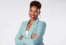 Portrait of Monica McNutt, basketball analyst and media personality, confidently presenting insights on sports with a professional backdrop.
